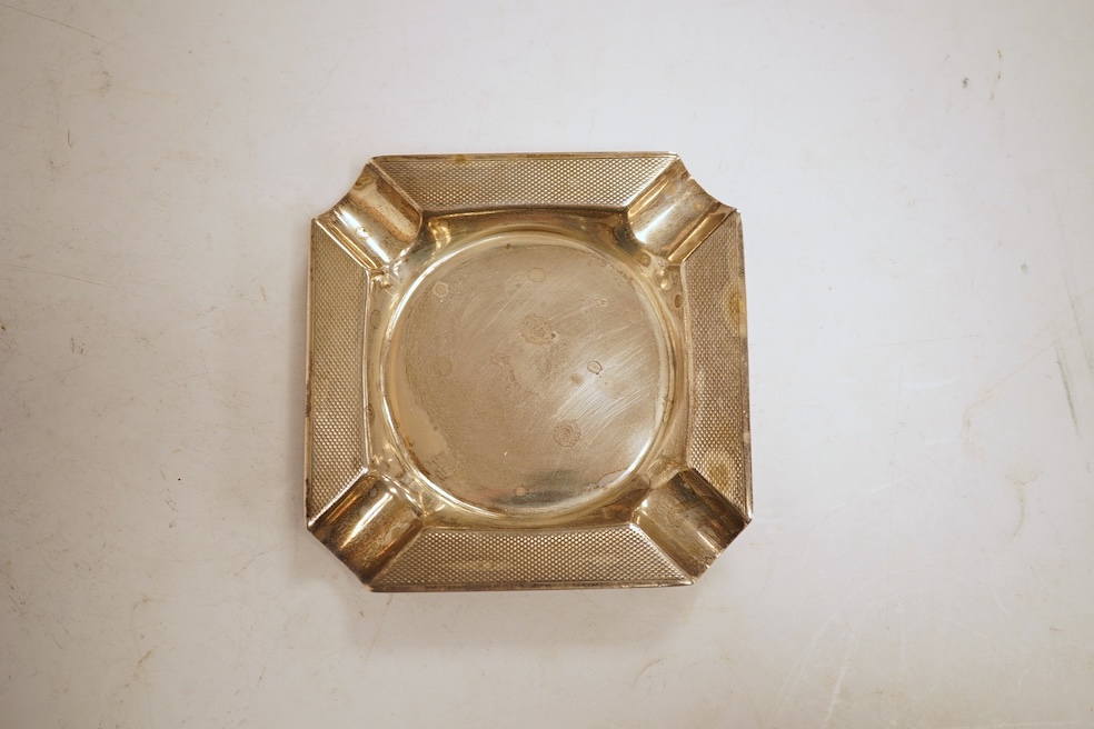 A heavy square engine-turned silver ashtray, by Mappin & Webb, Sheffield, 1964, 99mm, 6oz.
